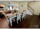 Open dining area with a staircase, hardwood floors, and ample natural light at 712 Harrier Rd, Charlotte, NC 28216
