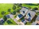 Aerial view of homes, manicured lawns and tree-lined street with street parking at 7344 Gilead Rd, Huntersville, NC 28078