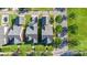 Aerial view of neighborhood with well-maintained lawns, street parking, and tree lined street at 7344 Gilead Rd, Huntersville, NC 28078