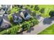 Charming neighborhood featuring well-maintained homes, mature trees, and manicured lawns from an aerial view at 7344 Gilead Rd, Huntersville, NC 28078