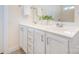 Bathroom with double sinks and white cabinetry at 7344 Gilead Rd, Huntersville, NC 28078