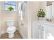 Bathroom featuring a toilet, sink and towel rack at 7344 Gilead Rd, Huntersville, NC 28078