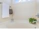 Close-up of a white bathtub with a small window above it at 7344 Gilead Rd, Huntersville, NC 28078
