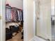 Walk-in closet with hanging clothes and storage at 7344 Gilead Rd, Huntersville, NC 28078