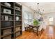 Inviting dining area featuring a wooden table with bench seating and a stylish chandelier at 7344 Gilead Rd, Huntersville, NC 28078