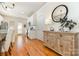 Elegant dining space with hardwood floors, a mirror, and a modern chandelier at 7344 Gilead Rd, Huntersville, NC 28078
