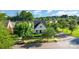 Charming home with well-kept lawn and mature trees enhancing curb appeal, with white picket fence at 7344 Gilead Rd, Huntersville, NC 28078