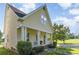 Charming home with a welcoming front porch, showcasing classic architectural details and landscaping at 7344 Gilead Rd, Huntersville, NC 28078
