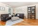 Cozy living room featuring comfortable seating, hardwood floors, and stylish decor at 7344 Gilead Rd, Huntersville, NC 28078