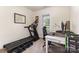 Office area featuring a treadmill, desk and window at 7344 Gilead Rd, Huntersville, NC 28078