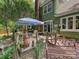 A lovely outdoor space with a wooden patio, seating area, and a grill, perfect for entertaining at 7639 Winterset Dr, Charlotte, NC 28270