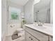 Bright bathroom showcasing white vanity, toilet, and a shower/bath with subway tile at 7639 Winterset Dr, Charlotte, NC 28270