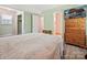 Spacious bedroom features a large dresser, closet, and calming decor at 7639 Winterset Dr, Charlotte, NC 28270