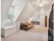 Attic bonus room with large window and space for a sitting and desk area at 7639 Winterset Dr, Charlotte, NC 28270
