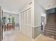 Open-concept kitchen, dining area with a staircase and hallway, offering a bright space for dining and relaxation at 7639 Winterset Dr, Charlotte, NC 28270