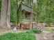 Unique backyard home on stilts, complete with stairs, porch, and fenced-in yard at 7639 Winterset Dr, Charlotte, NC 28270