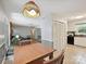Spacious interior showcasing a kitchen, dining area, and living room with a brick fireplace at 7639 Winterset Dr, Charlotte, NC 28270