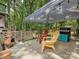 Outdoor patio area with a gas grill and a seating area under a canopy at 7639 Winterset Dr, Charlotte, NC 28270