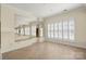 Bright room with large windows and tile floors, complemented by mirrored walls at 765 Cherry Hills Pl, Rock Hill, SC 29730