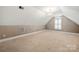 Spacious bedroom featuring neutral carpet, large window, and chandelier lighting at 765 Cherry Hills Pl, Rock Hill, SC 29730