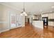 Open concept dining room with access to an outdoor patio and views of the modern kitchen at 765 Cherry Hills Pl, Rock Hill, SC 29730