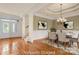 Dining room features elegant chandelier, tray ceiling, and paneled walls at 765 Cherry Hills Pl, Rock Hill, SC 29730