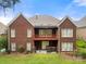 Two-story brick home with a spacious backyard, patio, and upstairs deck at 765 Cherry Hills Pl, Rock Hill, SC 29730