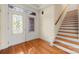 Inviting foyer with decorative glass doors and wood staircase at 765 Cherry Hills Pl, Rock Hill, SC 29730