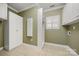 Efficient laundry room with built-in shelving and storage cabinets, offering ample space at 765 Cherry Hills Pl, Rock Hill, SC 29730