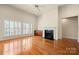 Spacious living room with fireplace, hardwood floors, and large windows providing natural light at 765 Cherry Hills Pl, Rock Hill, SC 29730