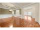 Spacious living room with hardwood floors, crown molding, and ample natural light creating a warm and inviting atmosphere at 765 Cherry Hills Pl, Rock Hill, SC 29730