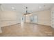 A living room with french doors, neutral colored walls, and recessed lighting fixtures at 765 Cherry Hills Pl, Rock Hill, SC 29730