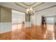 Inviting living room with hardwood floors, crown molding, and a decorative chandelier at 765 Cherry Hills Pl, Rock Hill, SC 29730