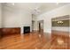 Open living area featuring fireplace, ceiling fan, and a view to other rooms of the house at 765 Cherry Hills Pl, Rock Hill, SC 29730