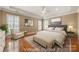 Spacious main bedroom with tray ceiling, sitting area, and plenty of natural light at 765 Cherry Hills Pl, Rock Hill, SC 29730