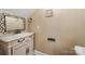 Charming powder room featuring a decorative mirror and a stylish vanity at 765 Cherry Hills Pl, Rock Hill, SC 29730