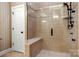 Modern walk-in shower featuring a frameless glass enclosure and tiled bench seat at 765 Cherry Hills Pl, Rock Hill, SC 29730
