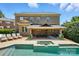 Beautiful backyard with a pool, covered patio, and lush landscaping perfect for outdoor entertaining at 7903 Tottenham Ct, Waxhaw, NC 28173