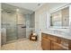 Updated bathroom featuring a large walk-in shower and a modern vanity with good lighting at 7903 Tottenham Ct, Waxhaw, NC 28173