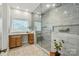 Bathroom with a large walk-in shower, patterned tile, and vanity at 7903 Tottenham Ct, Waxhaw, NC 28173