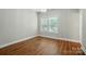 Bedroom with hardwood floors and natural light at 7903 Tottenham Ct, Waxhaw, NC 28173