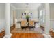 Elegant dining room with chandelier, wainscoting, and a neutral color palette at 7903 Tottenham Ct, Waxhaw, NC 28173