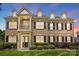 Beautiful brick two-story home with dormers, black shutters and mature landscaping at 7903 Tottenham Ct, Waxhaw, NC 28173
