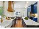 Bright kitchen with navy cabinets, stainless steel appliances, and a breakfast nook at 7903 Tottenham Ct, Waxhaw, NC 28173