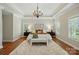 Spacious main bedroom with tray ceiling, neutral colors, and a plush area rug at 7903 Tottenham Ct, Waxhaw, NC 28173