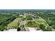 Aerial view of a neighborhood with sports fields, parking lots, and academic buildings at 805 Caldwell St, Belmont, NC 28012