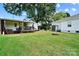 Expansive backyard with a deck, shed, fire pit, and green lawn perfect for outdoor activities at 805 Caldwell St, Belmont, NC 28012