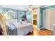 Bright bedroom with hardwood floors, a ceiling fan, natural light and an attached bathroom offers space and function at 805 Caldwell St, Belmont, NC 28012
