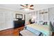 Bedroom with wood-look flooring, large closet, and decorative touches at 805 Caldwell St, Belmont, NC 28012