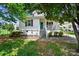 Charming home featuring a quaint front porch and well-maintained landscaping at 805 Caldwell St, Belmont, NC 28012